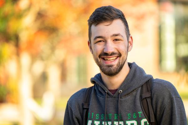 Student on campus in autumn